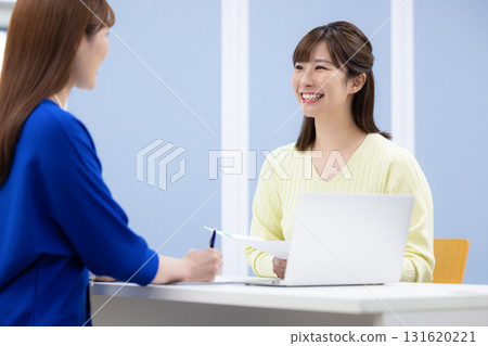 Counseling: A woman consulting at the counter Counseling: A woman consulting at the counter 131620221