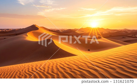 Sahara sunset paints the sand dunes in a fiery orange glow, highlighting the arid landscape for a memorable travel adventure 131621070