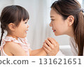 Mother and girl talking 131621651