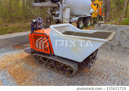 Compact tracked dumper is ready to transport concrete on construction site 131621728