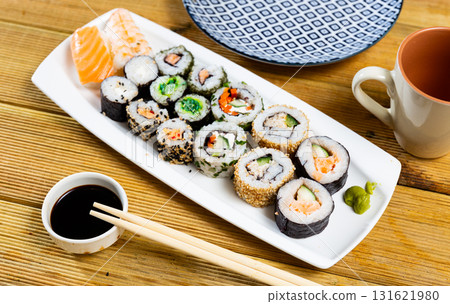 On table there portion set with maki - uramaki and nigiri 131621980