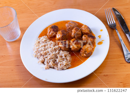 Oatmeal served with meatballs on plate Oatmeal served with meatballs on plate 131622247