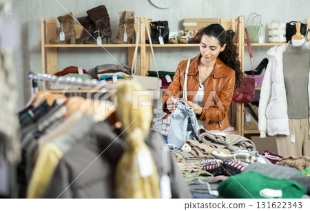 Armenian woman choosing jeans pants and pants in the store 131622343
