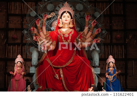 Vibrant Goddess Durga Idol with Golden Chalchitra and Family in Pandal 131622401