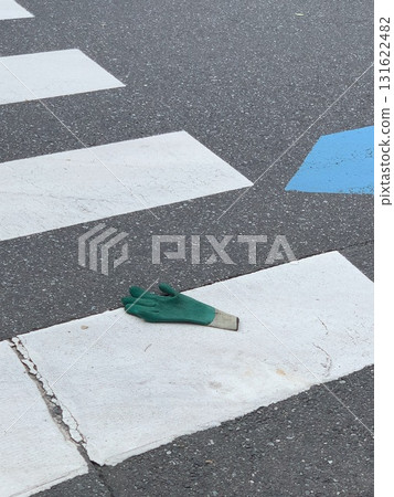 Gloves left behind at the crosswalk 131622482