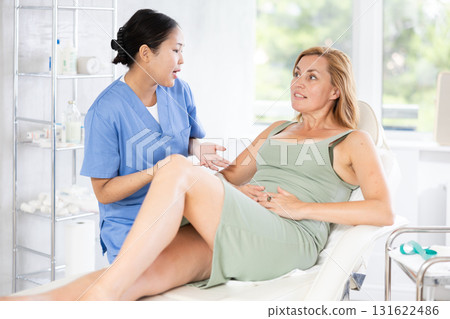 Young doctor conducts consultation 131622486