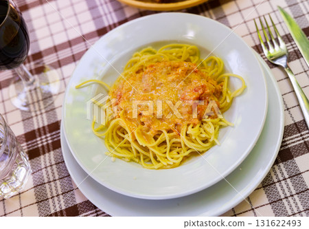 Plate with pasta, made with in salmon sauce 131622493