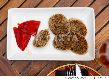 Traditional spanish girella lamb sausage on plate Traditional spanish girella lamb sausage on plate 131622564