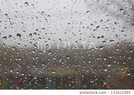 Rainy autumn street view through window Rainy autumn street view through window 131622885