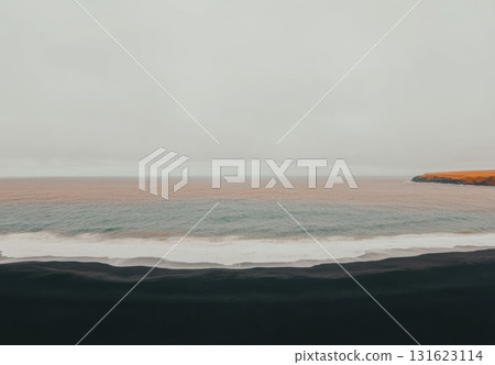 Coastal view with waves and overcast skies at a remote beach location Coastal view with waves and overcast skies at a remote beach location 131623114