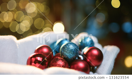 santa claus hand with colored balls 131623554