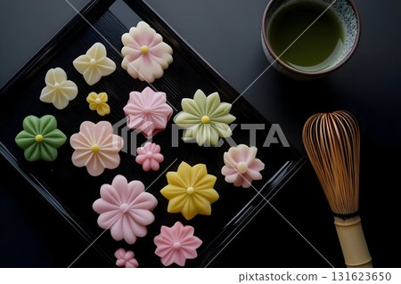 handcrafted Japanese wagashi, specifically delicate nerikiri sweets, placed on an elegant black lacquer tray 131623650