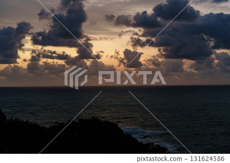 Dawn over the Kumano Sea in Katsuura, Nanki: Clouds rising in the golden sky and the sea surface reflecting a pale light① Dawn over the Kumano Sea in Katsuura, Nanki: Clouds rising in the golden sky and the sea surface reflecting a pale light① 131624586