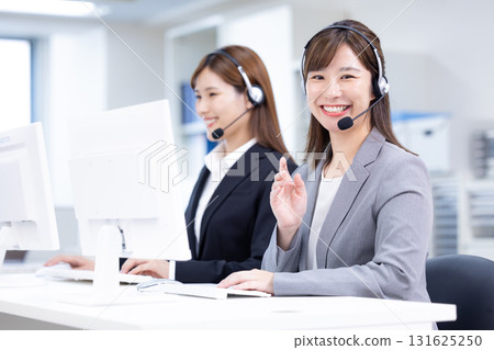 Business woman wearing an intercom 131625250