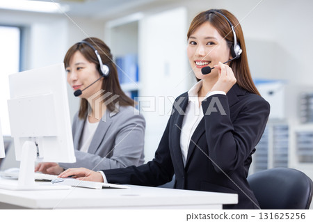Business woman wearing an intercom Business woman wearing an intercom 131625256