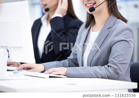 Business woman wearing an intercom 131625556