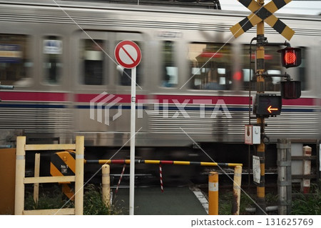 Railroad crossing and running train 131625769