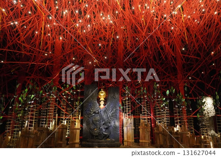 Conceptual Durga Idol in Dark Tone with Red Thread and Light Installation Pandal 131627044