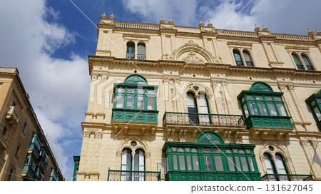 View of old building with windows, balconies in city. Republic of Malta, the picturesque city Valetta, Malta. 131627045