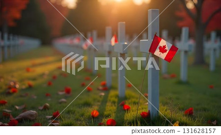 A Canadian flag draped over a cross in a field, commemorating veterans and their service on Remembrance Day 131628157