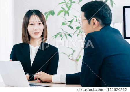 Business woman showing tablet 131629222