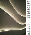 Close-up wavy curve pattern textured panel wall, glowing with led lights 131630287