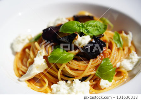 Tomato pasta with eggplant and mozzarella Tomato pasta with eggplant and mozzarella 131630318