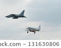 Two fighter jets fly through the sky on technology background 131630806