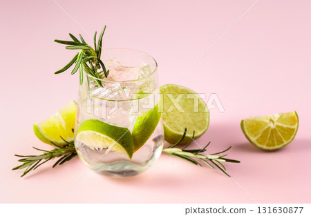 Summer refreshing drink with ice, lime and rosemary. Summer refreshing drink with ice, lime and rosemary. 131630877