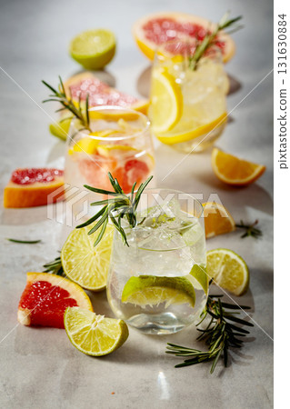 Summer refreshing drinks with ice, citrus and rosemary. Summer refreshing drinks with ice, citrus and rosemary. 131630884
