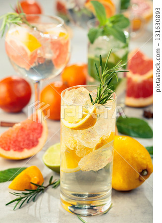 Refreshing summer cocktails with citrus on a white marble table. Refreshing summer cocktails with citrus on a white marble table. 131630893