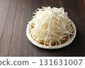 Bean sprouts in a colander with a wood grain background 131631007
