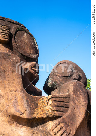 Ancient tiki statue in Atuona, Hiva Oa, Marquesas Islands, French Polynesia Ancient tiki statue in Atuona, Hiva Oa, Marquesas Islands, French Polynesia 131631116