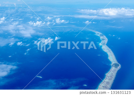 Aerial view of the Tuamotus atoll in French Polynesia with clouds 131631123