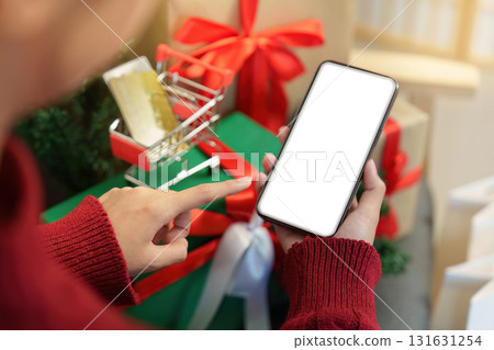 Pointing at Smartphone for Holiday Shopping Pointing at Smartphone for Holiday Shopping 131631254