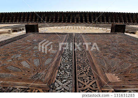 Carved wooden door details with geometric patterns, Bou Inania Madrasa. Fez, Morocco 131631283