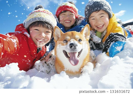 Shiba Inu playing in the snow with kids 131631672