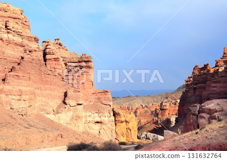 Picturesque scenery of Charyn Canyon in the sunset light, northern region of Tien Shan Mountains. Famous landmark Natural monument Valley of Castles, National Nature Park, Almaty region, Kazakhstan 131632764