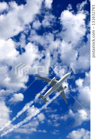 Horizontal nature background with aircraft and Jet trailing smoke in sky. Airplane and condensation trail. Foggy jet trail and plane in blue sky with white clouds. Traveling the world concept 131632765