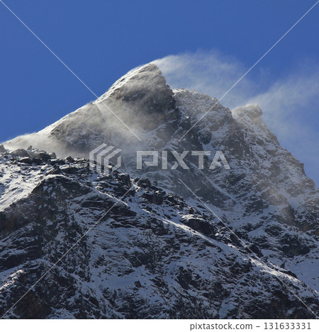 Snow blown over a high mountain in the Langtang Valley, Nepal.. 131633331