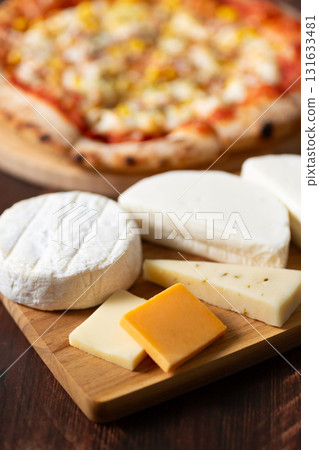 Cheese platter and pizza 131633481