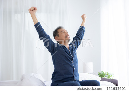 Middle-aged man stretching in the morning Middle-aged man stretching in the morning 131633601