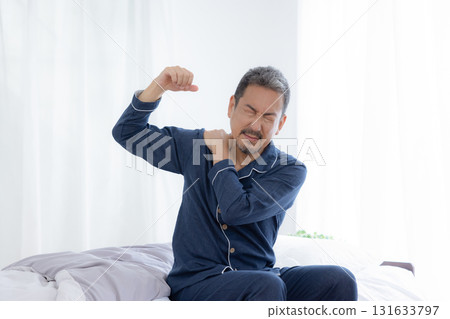 Middle-aged man stretching in the morning Middle-aged man stretching in the morning 131633797