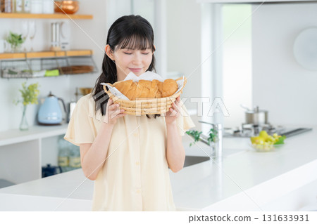 Middle-aged woman making bread in the kitchen 131633931