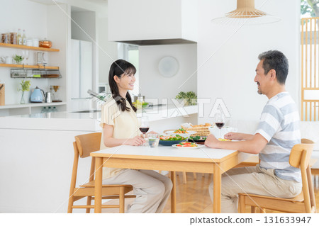 A middle-aged couple eating in the dining room A middle-aged couple eating in the dining room 131633947