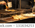 Grilled whole squid at a Taiwanese food stall 131634253