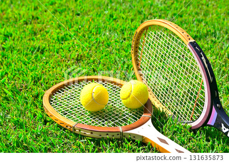 Tennis ball on top of a tennis racket 131635873