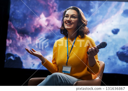 woman is giving a presentation at conference woman is giving a presentation at conference 131636867