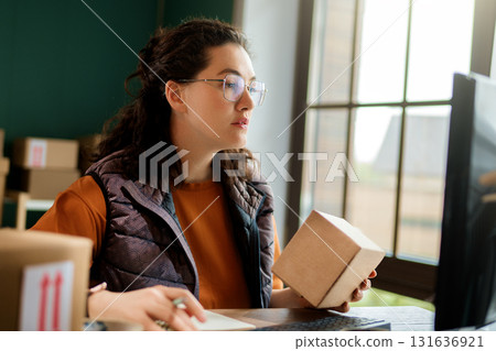 Woman working in a warehouse Woman working in a warehouse 131636921