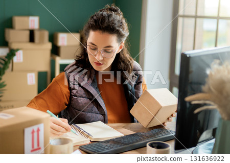 Woman working in a warehouse Woman working in a warehouse 131636922